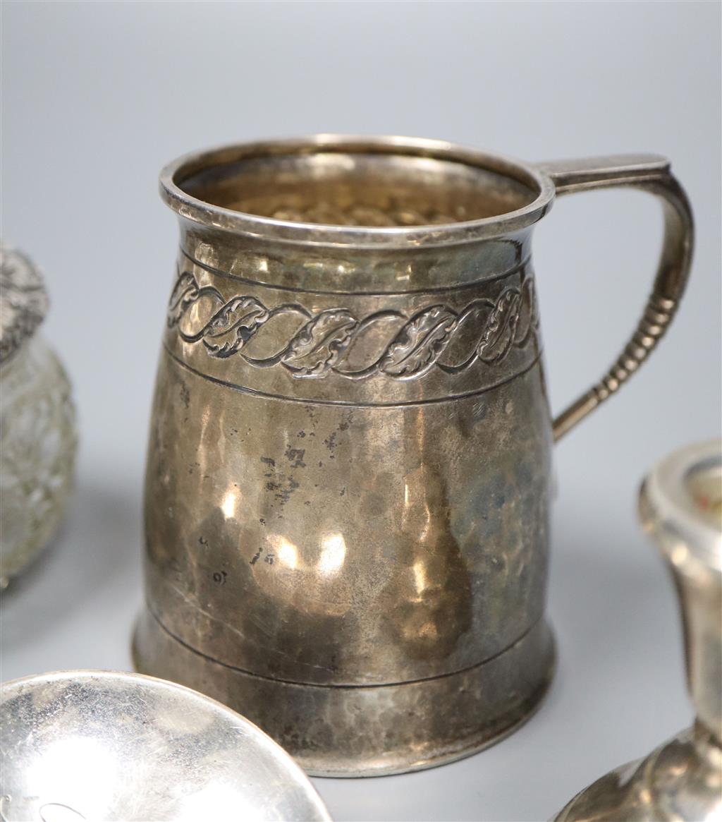A silver Christening mug, a pair of silver seal top spoons and sundry silver,